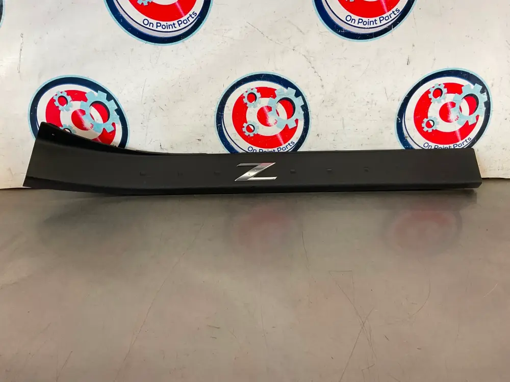 2005 Nissan 350Z Passenger Right Door Kick Plate Trim 769B0 OEM 25BF9D7