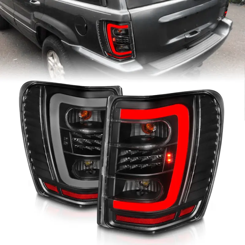 ANZO 1999 2004 Jeep Grand Cherokee LED Tail Lights w Light Bar Black Housing Clear Lens