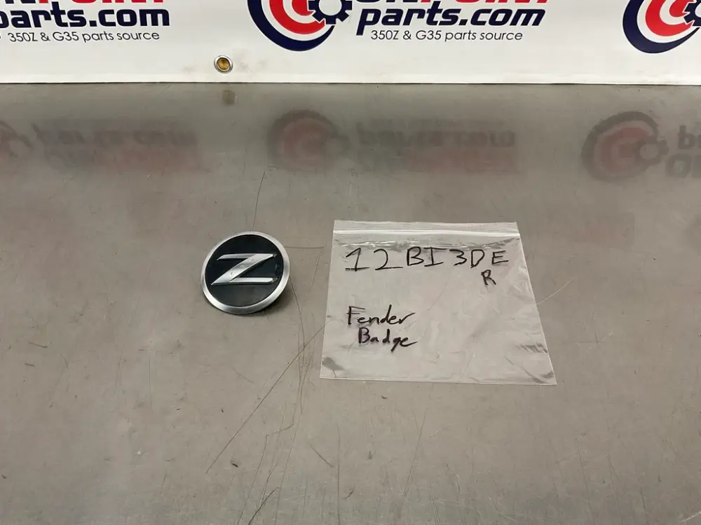 2006 Nissan 350Z Passenger Right Front Exterior Fender Emblem Badge OEM 12BI3DE